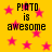 Yellow background with pink stars and black pixelated text reading "P!OTO is awesome" in four quadrants.