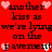 Red background with black text repeating 'another kiss as we're lying on the pavement' and pink/white heart icons scattered throughout.