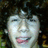 A person with curly dark hair and light skin appears in a of four , showing subtle variations in facial expression across the sequence