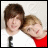 Two young men in close pose, one in white shirt and dark tie, the other in red top; lower section displays text 'fletcher jones.' with pixelated heart symbol.