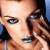 Pixelated close-up of two people's faces with one person touching the other's cheek, set against a blue background.