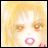 Pixelated image of a character with blonde hair, red eyes, and pink lips on a light background, next to black background with white text.