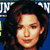 Static pixelated image of a person with dark curly hair against a blue background, featuring partial visible text elements at the top and left edges.