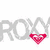Pixelated ROXY logo with pink heart symbol on white background, ROXY text in pink on beach scene, SURFER text in green on wave background.