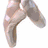 A sequence of four cropped images showing a person's legs in different poses, including bare feet and black shoes against white backgrounds.