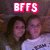 Two people pose together under a red and white pixelated 'BFFS' text overlay on a dark background.