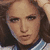 A pixelated image of a person with long brown hair wearing a white jacket with blue trim, with the text "cofek" overlaid in bold black letters.