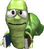 Green cartoon turtle with large eyes and a smile holds two books, one blue and one brown, against a gray background.