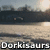 A static image of a snowy landscape with a bridge, trees, and a bright sun reflecting on water, overlaid with the text "Dorkisaurs" in white pixelated font.