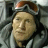 Static 48x48 pixel buddy icon showing a person with brown hair wearing a dark helmet and light-colored jacket against a gray background.