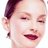 Static 48x48 pixel icon of a woman's face with dark hair pulled back, closed eyes, and red lips against white background.