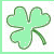 Green four-leaf clover icon with heart-shaped leaves and stem, surrounded by green text 'Kiss me I'm Irish' in pixelated font above three of identical 'Irish' text with hearts below each