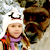 Static buddy icon featuring a pixelated image of a person in winter clothing next to a large brown bear-like figure with dark eyes and nose, set against a light background.