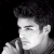 Black-and-white pixelated portrait of a person with dark hair holding an object near their face, next to green text reading 'Original Icons .com' on a solid background.