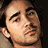 A pixelated image of a person's face on the left and red background with black text reading 'this man is mad hott!!' on the right.