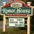 A pixelated sign with green background and red trim displays 'Forest House' in white text above a smaller white panel with green squares.