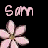 Pixelated pink flower icon with partial text "Sam" on black background, two frames showing slight bloom variation.