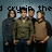 Four people stand in a group against a blue background with text above them; the rightmost person's face is partially obscured in one view.