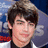 A pixelated image of a person with dark hair and light skin on the left, next to text reading "Just Call Me" above "I LOVE JOE JONAS!" in black letters on a bright pink background.