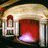 Pixelated image of a building entrance with red door and glowing light, split into four quadrants with orange text on black backgrounds.