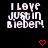 Pixelated text reads "I LOVE JUSTIN BIEBER" in white on black background with red heart symbols below.