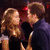 Animated sequence of two people in a dark setting, transitioning from embracing to kissing with changing hand positions and facial expressions.