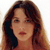 Static 50x50 pixel icon showing a woman's face with long brown hair and light skin tone, rendered in low-resolution pixel art style against white background.