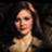 Pixelated static image of a person with dark hair and light skin tone against a black background, rendered in low-resolution 256x256 pixels.
