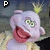 Animated icon of a purple puppet-like character with green eyes and pink mouth, wearing yellow clothing against dark background.