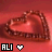 A heart-shaped chocolate with a textured surface on a red background, featuring 'ALI' text and two pixelated hearts below.