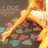 A pixelated image shows a figure with a bright orange-yellow glow, dark hair, and a blurred background with faint text.