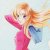 Pixelated figure with long orange hair wearing pink top and blue pants, arms raised in dynamic pose against light background.