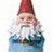 Pixelated garden gnome with red hat and white beard appears on left, while right side displays scrolling red text reading 'I HAVE SOMETHING 2 TELL U IM A GNOME' against black background.