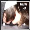 A static image shows a person with long brown hair leaning forward, with the word 'kisses' and a heart symbol visible in the top-right corner.