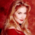 A pixelated image of a person with long light brown hair wearing red clothing against a solid red background, next to green text on dark green.