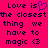 Pixelated text on bright pink background with heart symbol replacing 'is' in 'Love is', repeated twice with 'magic <3' at bottom.