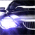 A car's front grille and headlights in a of nine , with headlights transitioning from bright white to purple glow across frames