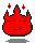 Red pixelated flame-shaped character with closed eyes and a smiling mouth, small red spark accents above head, gray shadow beneath.