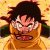 Pixelated image of a character with spiky dark hair, orange clothing, and an intense facial expression against a yellow background.