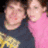A blue background displays a pixelated photo of two people, with pink text reading "amy and michael" above and "i love them so much" below.