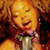 Animated contact sheet showing two frames of a celebrity singing with a CoolBuddy.com logo on the right side against a blue background.