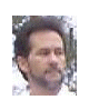 A man with dark hair and a beard appears in , showing facial expression changes from neutral to smiling while green lines animate across his face