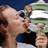 Static 48x48 pixel icon showing two tennis players kissing on a court with blurred background elements.