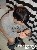 Pixelated image of a person with dark hair wearing a light-colored shirt, holding a child with light hair in a close embrace.