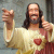 Pixelated image of a figure with long dark hair and beard wearing a light robe with red accents, making a pointing gesture with both hands, next to bold text reading 'Aim phuck .com'.