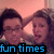 Two people in close proximity with a pinkish background and blue text reading 'fun times' at the bottom.