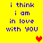 Yellow background with blue pixelated text reading "i think i am in love with you" and two heart icons, one red and one orange.