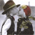 Animated sequence of a person in dark clothing and hat kissing another figure with red hair, showing text changes from 'love' to 'true'.