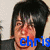 A pixelated image of a person with black hair and red cheeks, with blue text reading 'chris' overlaid on the lower face area.