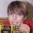 Static 48x48 pixel icon showing a person with brown hair and red clothing holding a yellow sign with black text, rendered in low-resolution pixel art style.
